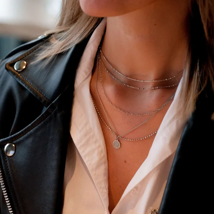 Layered silver chains worn every day